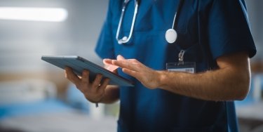 Medical professional using a tablet 