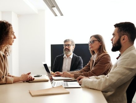 four people meeting