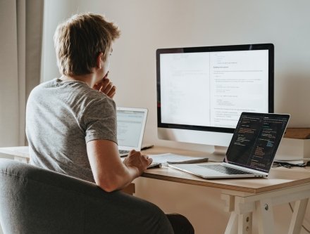 man looking at computer screen