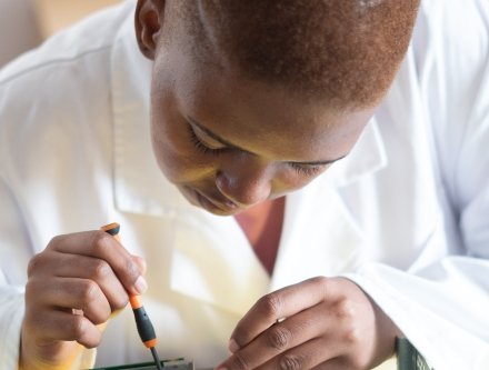 woman performing hardware repair